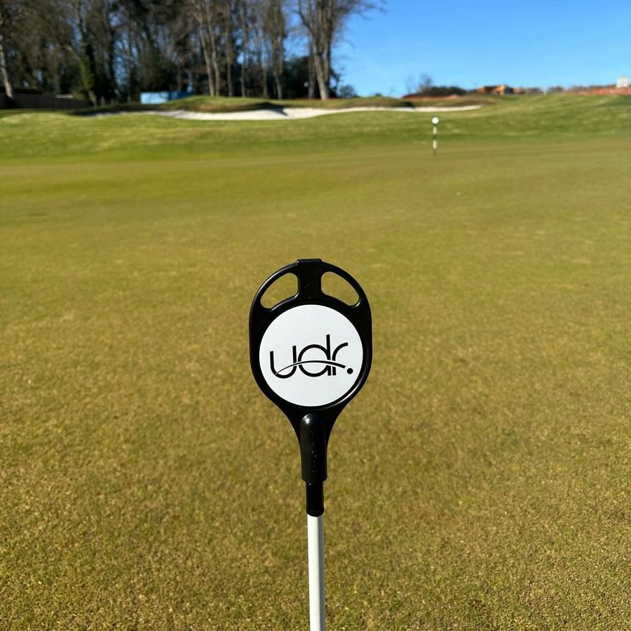 A UDR flag marker on the practice green